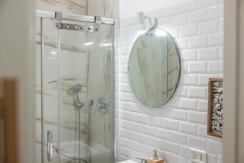 a bathroom with a shower and a sink and a mirror at Antiche Mura in Bari
