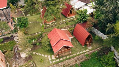 an overhead view of a house with red roofs at Lalinggo Bungalow in Tetebatu