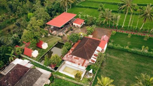 an aerial view of a house with a red roof at Lalinggo Bungalow in Tetebatu