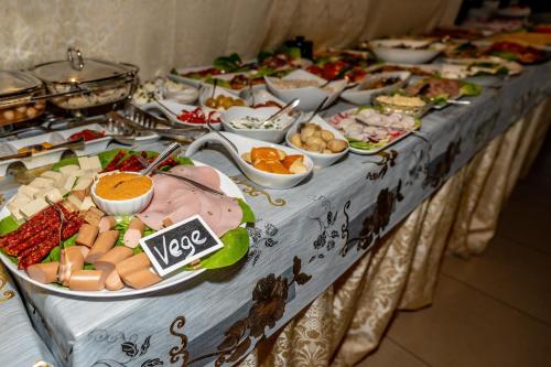 a buffet table with many different types of food at Resort Morawa in Stronie Śląskie