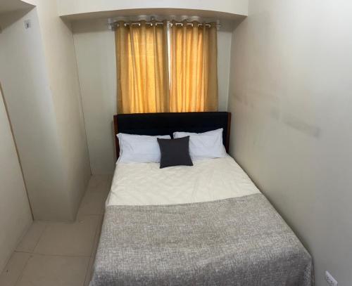 Postel nebo postele na pokoji v ubytování New 1BR in Mandaluyong