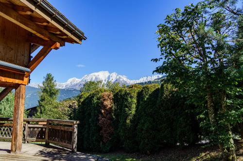 a porch of a house with a view of a mountain at Chalet des Sommets in Combloux