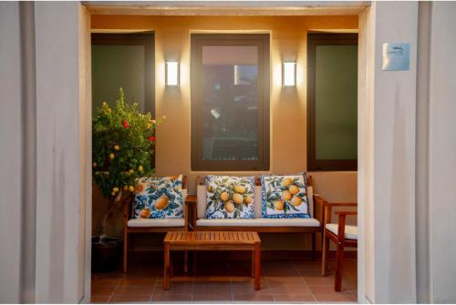 a porch with a bench with fruit on it at Teremok Holiday Homes in Dubai
