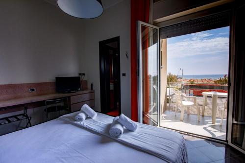 Ένα ή περισσότερα κρεβάτια σε δωμάτιο στο Hotel Derby