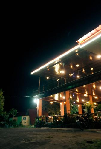 a gas station at night with lights on it at Lalinggo Bungalow in Tetebatu