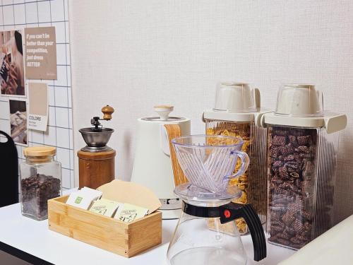 a blender sitting on top of a counter with other items at COZY BUTTERHOUSE, Near Metro, Close to Airport, Hongdae, WIFI, Long Biz Trip, Local Vibe in Seoul
