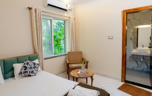 Postel nebo postele na pokoji v ubytování Palolem Apartments
