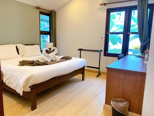 Postel nebo postele na pokoji v ubytování begonia N7 villa resort海棠7号别墅酒店