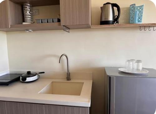a kitchen with a sink and a counter top at Northwoods Place Condominium Unit1026 in Mandaue City