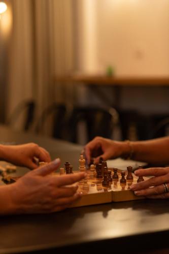 two people playing a game of chess on a table at Le Pavillon de la Kasbah & SPA Marrakech in Marrakech