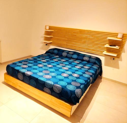 a bed in a room with a wooden frame at Modern and quiet apartment in Rome