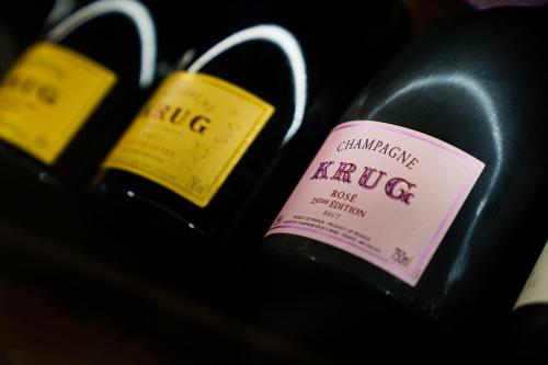 two bottles of red wine with labels on them at Belfiore Park Hotel 4Stars Superior "Adults Only" in Brenzone sul Garda