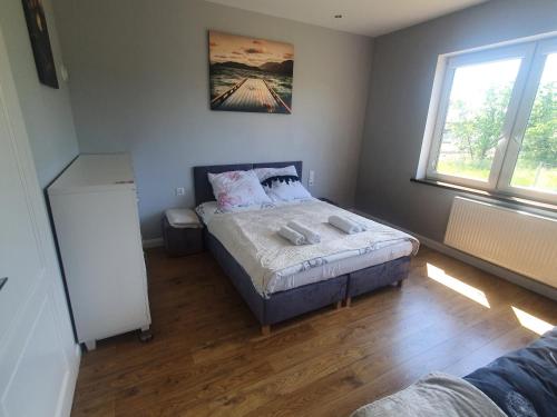 Ein Bett oder Betten in einem Zimmer der Unterkunft Apartament nr 2 Chorzelów