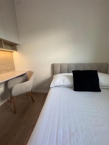 Ένα ή περισσότερα κρεβάτια σε δωμάτιο στο Apartament Puck Holliday