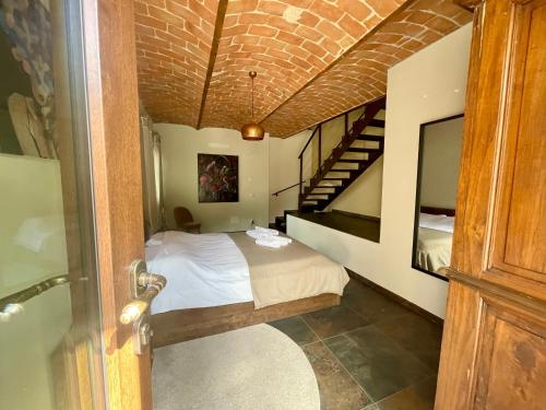 Un ou plusieurs lits dans un hébergement de l'établissement Casa di Mia Zia Bed & Wine - Villa Uve