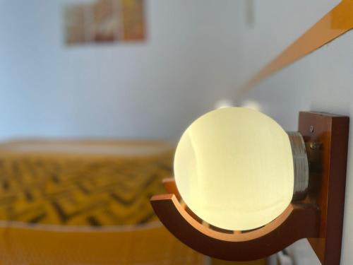 a close up of a light on a wall at New View Homestay in Veer Savarkar International Airport