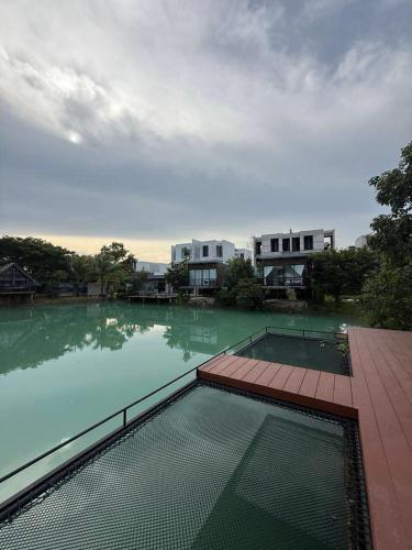 a large pool of water with buildings in the background at The wide view resort and restaurant Phuket in Thalang