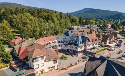 an aerial view of a town in the mountains at Penzion Mona Rooms & Apartments in Harrachov