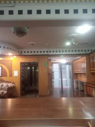 an empty room with a hallway and a room with a door at Hotel Tela Family stay Near IGI Airport Delhi 