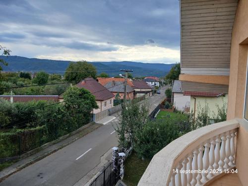 a balcony with a view of a street and houses at Casa David in Sighetu Marmaţiei