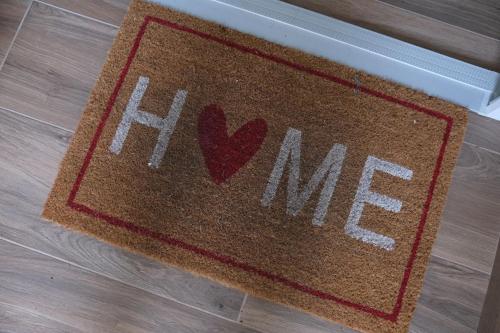 a sign that says i love me on a floor at Cortile San Luigi in Capo dʼOrlando