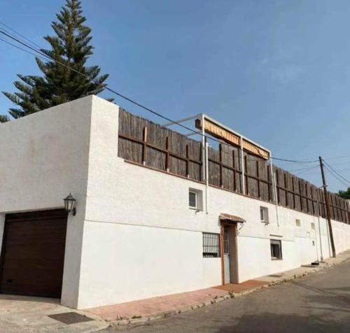a white building with a lot of windows on it at Apartment Málaga Airport in Cártama