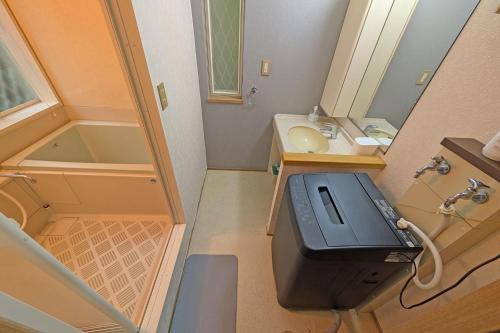 Koupelna v ubytování 森に抱かれた別荘