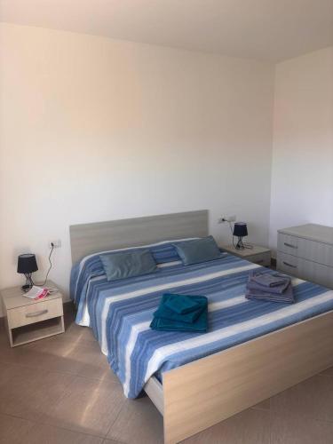 En eller flere senge i et værelse på Casa Angela