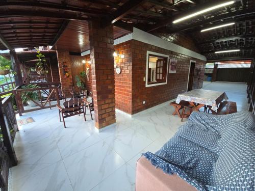 Χώρος καθιστικού στο Chalé Aconchegante com Vista para Piscina