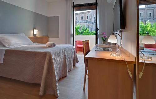 Кровать или кровати в номере Hotel Terme Marco Polo
