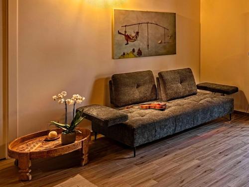 a living room with a couch and a table at Picarò Suite in Pontecagnano