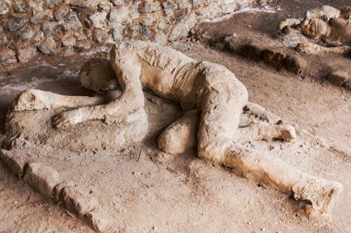 a statue of a person laying in the sand at Picarò Suite in Pontecagnano