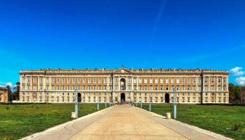 a large building with a pathway in front of it at Picarò Suite in Pontecagnano
