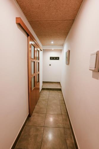 a corridor in an office building with a door and a hallway at Hospedium Hotel Continental in Mojácar
