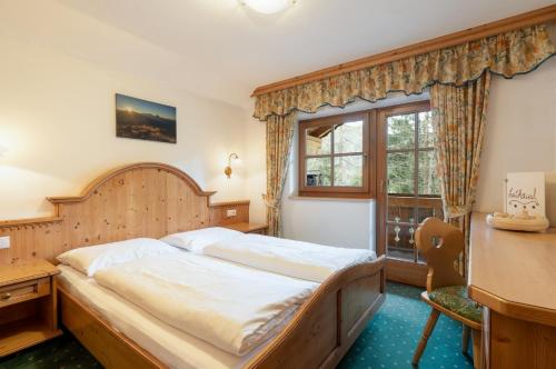 Una cama o camas en una habitación de Leithäusl