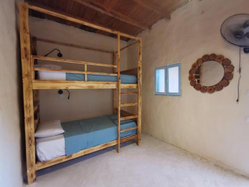 a bunk bed room with two bunk beds in a room at Siwa Oracle Hostel in Siwa