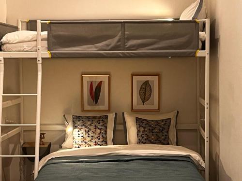a bedroom with two bunk beds with pillows at Suite Nr 9 - J26 LUXURY APARTHOTEL, Jauniela 26 Old Riga - Top Location in Rīga