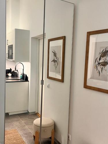 a bathroom with a glass door to a kitchen at Suite Nr 9 - J26 LUXURY APARTHOTEL, Jauniela 26 Old Riga - Top Location in Rīga