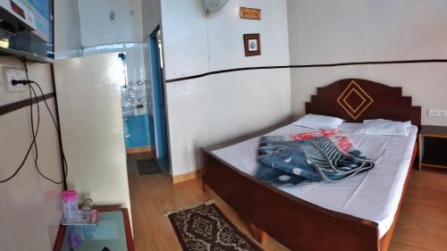 Aasara Homestay Vill Soli Kausaniにあるベッド