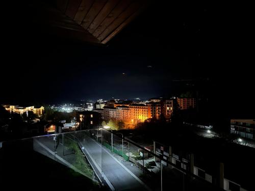 a view of a city at night with street lights at The Valley Bakuriani in Bakuriani