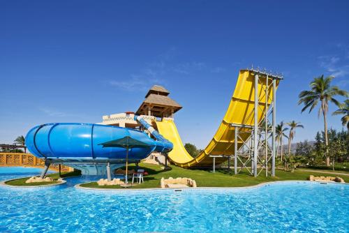 a water park with a water slide and a water slide at Juweira Boutique Hotel Adult only in Salalah