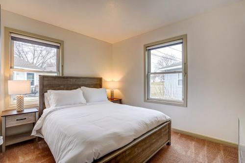 a bedroom with a large bed and two windows at 30 Day Minimum - Entire House - Washer & Dryer and AC in Middleton