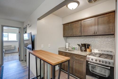 a kitchen with wooden cabinets and a wooden table at Private entrance Free Parking Near Medical Cente in West Allis