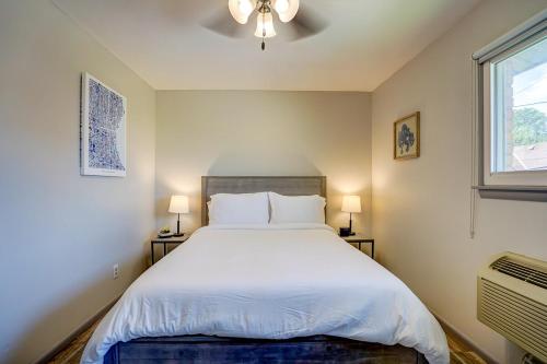 a bedroom with a large white bed and a window at Private entrance Free Parking Near Medical Cente in West Allis
