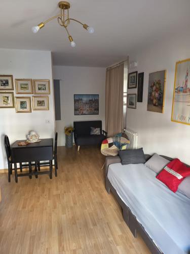 a bedroom with a bed and a table and a desk at Come a Casa in Caserta