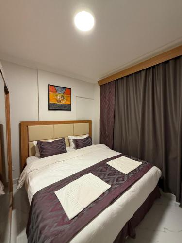 Katil atau katil-katil dalam bilik di Apartment in Al Telal Tower