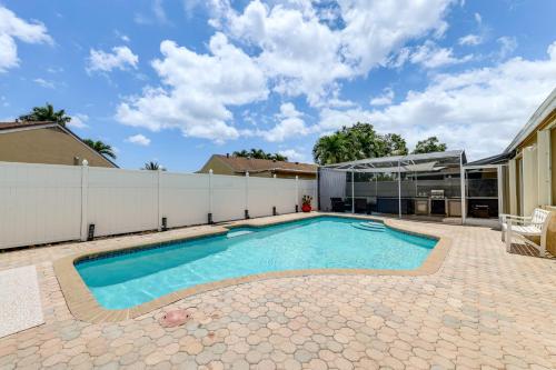 a swimming pool in the backyard of a house at Golf and Shop Gem with Private Pool in Boca Raton in Boca Raton
