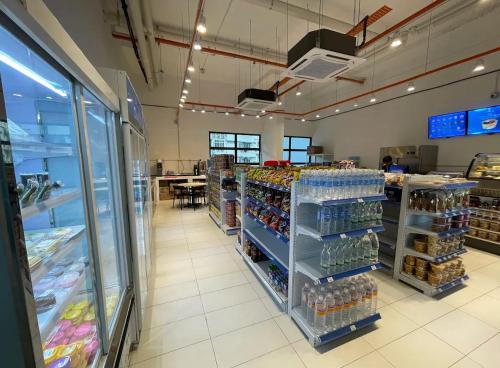 a grocery store aisle with a lot of drinks at 7-06 Kenny Hill Residence 1 Kuching in Gua Sai