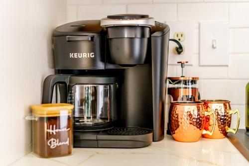 a coffee maker on a counter in a kitchen at Prime Location Top Rated Clean Parking Free! in Chillicothe