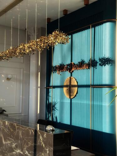 a chandelier hanging over a counter in a room at Hotel Dardani in Mitrovicë
